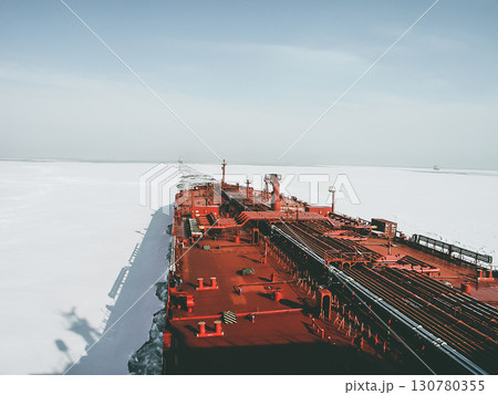 View from the captain's bridge to the deck of a large crude oil tanker sailing among the ice View from the captain's bridge to the deck of a large crude oil tanker sailing among the ice 130780355