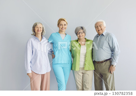 Senior people and caring nurse, doctor, caregiver medical worker in uniform group portrait Senior people and caring nurse, doctor, caregiver medical worker in uniform group portrait 130782358