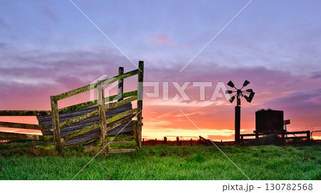 Farm Old Loading Ramp And Wind Pump 130782568