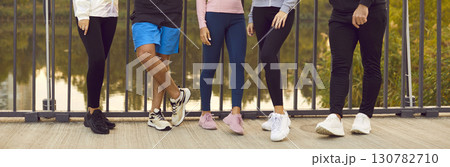Close Up Of Friends Legs During Outdoor Fitness Workout 130782710