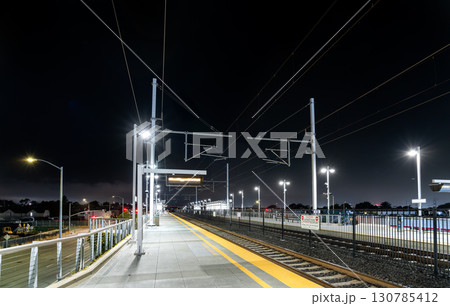 The modern Caltrain station in San Bruno, California, USA, on the San Francisco - San Jose line. The empty platform is illuminated under a dark night sky The modern Caltrain station in San Bruno, California, USA, on the San Francisco - San Jose line. The empty platform is illuminated under a dark night sky 130785412