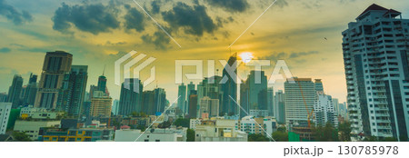 Sunset Amazing Bangkok city skyline with blue sky. Golden time Beautiful skyscraper bangkok midtown landscape. Capital building background modern office district. downtown City night life Sunset Amazing Bangkok city skyline with blue sky. Golden time Beautiful skyscraper bangkok midtown landscape. Capital building background modern office district. downtown City night life 130785978