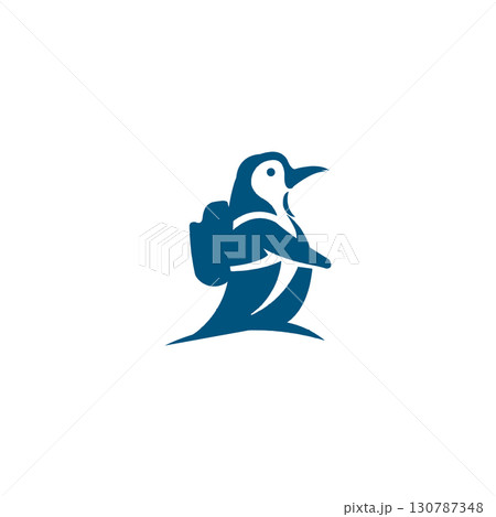 Stylized blue and white illustration of a penguin standing on a rock with grass against a white background 130787348