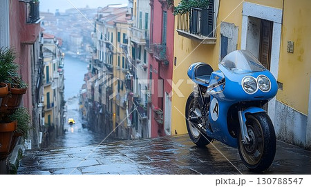 Blue Motorcycle Parked on Wet Street in Venice with Colorful Bui 130788547
