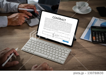 Digital contract concept: tablet screen with electronic signature form, keyboard, stylus, and office desk setup for business agreement, legal document signing, remote work, and e-signature. 130788630