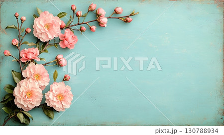 Soft Pink Flowers on Light Blue Background with Branches and Buds in Delicate Design 130788934