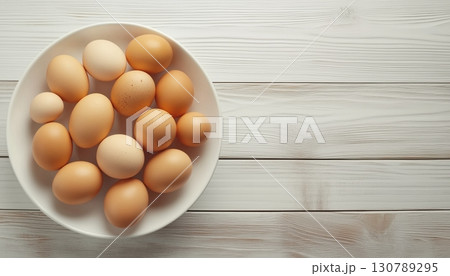 Chicken eggs organic fresh real food protein on white plate wooden table background 130789295