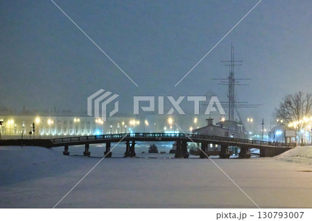 A serene winter landscape with a snow-covered bridge leading to a historic ship. The cold, hazy atmosphere and glowing lanterns create a peaceful and romantic setting. A serene winter landscape with a snow-covered bridge leading to a historic ship. The cold, hazy atmosphere and glowing lanterns create a peaceful and romantic setting. 130793007