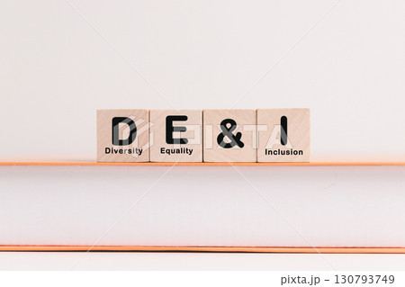 Business concept of diversity, equality, inclusion is symbol DEI written on wooden block, representing core values based on respect, fairness, equal opportunity. diversity, equality, inclusion Business concept of diversity, equality, inclusion is symbol DEI written on wooden block, representing core values based on respect, fairness, equal opportunity. diversity, equality, inclusion 130793749