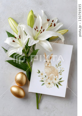 Easter greeting card with bunny and white lilies lying on gray background 130793935