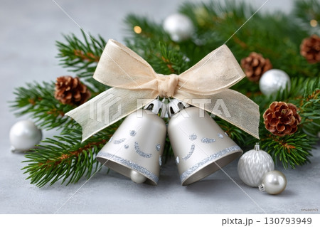 Christmas bells, pine cones, and fir branches create a festive atmosphere 130793949