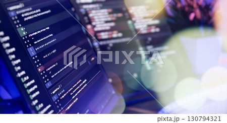 Close-up of coding screens in modern workspace 130794321