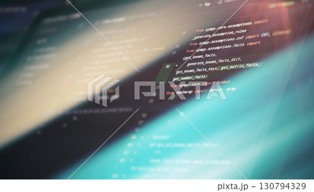 code in a sleek editor with highlighted function names and imports, representing focused software development work. 130794329