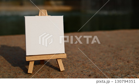 blank mini easel close up on granite surface with copy space blank mini easel close up on granite surface with copy space 130794351