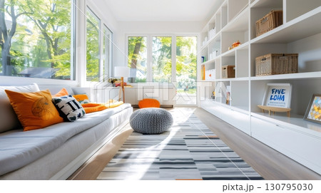 Sun shining through windows in modern playroom illuminating white bookshelf Sun shining through windows in modern playroom illuminating white bookshelf 130795030