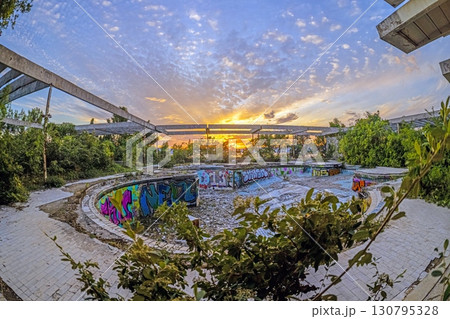 Sunset over ruined outdoor pools at Haludovo Palace Hotel Krk Croatia 130795328