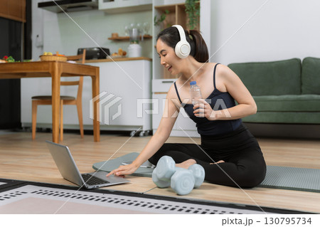 itness ,workout, home exercise ,lifestyle and healthy concept.Woman in exercise gear. 130795734