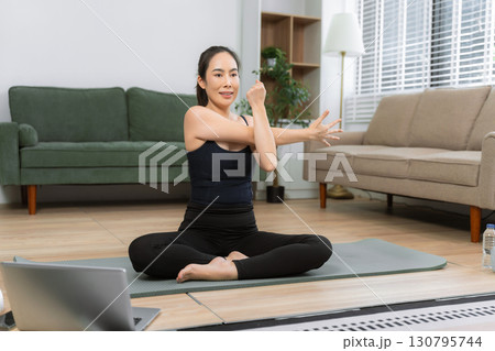 Healthy woman workout at home, exercise, fit, doing yoga, home fitness concept. healthy lifestyle. Healthy woman workout at home, exercise, fit, doing yoga, home fitness concept. healthy lifestyle. 130795744