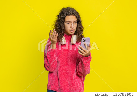 Upset sad girl use smartphone play game loses loss fail unlucky news bad lottery results crisis 130795900