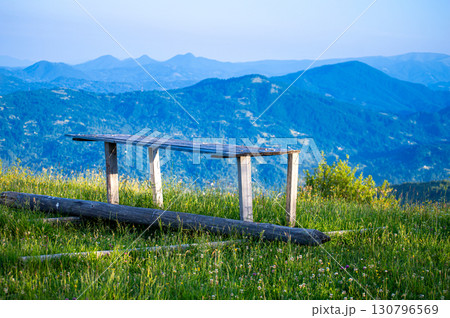 Carpathians mountains landscapes from green meadow with bench on sunset, Apetska mountain, Ukraine 130796569