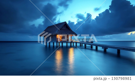 Night scene of one bungalows resort overwater stand alone with seascape at Bora Bora island, French Polynesia 130798981
