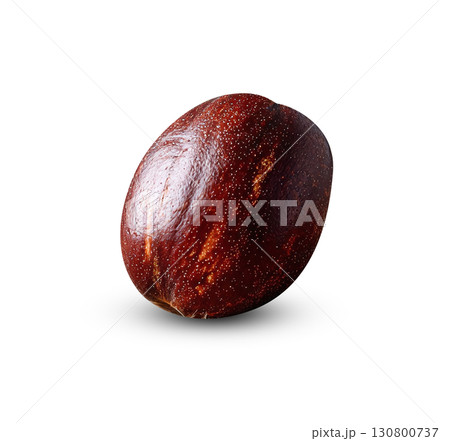A single nutmeg sits on burlap, showcasing its rich, warm tones and textured surface. Illustrates culinary themes, healthy eating, or ingredient photography. Aromatic spice concept. A single nutmeg sits on burlap, showcasing its rich, warm tones and textured surface. Illustrates culinary themes, healthy eating, or ingredient photography. Aromatic spice concept. 130800737