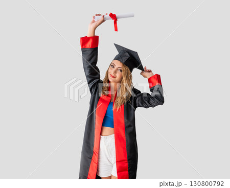 Happy young woman celebrating graduation with diploma Happy young woman celebrating graduation with diploma 130800792