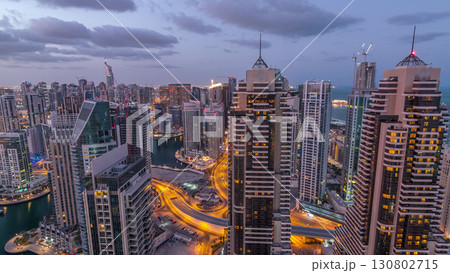Dubai Marina skyscrapers and jumeirah lake towers view from the top aerial night to day timelapse in the United Arab Emirates. 130802715