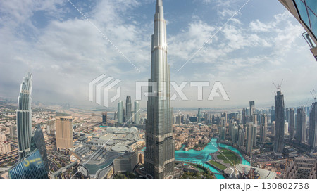 Panoramic skyline view of Dubai downtown with mall, fountains and Burj Khalifa aerial timelapse 130802738