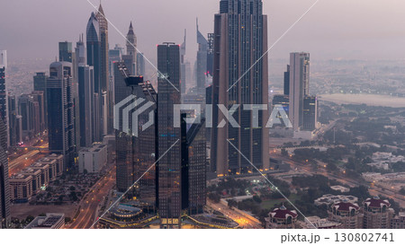 Dubai International Financial Centre district with modern skyscrapers night to day timelapse Dubai International Financial Centre district with modern skyscrapers night to day timelapse 130802741