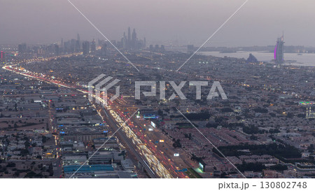 Aerial view to traffic on Sheikh Zayed road and intersection day to night timelapse, Dubai, United Arab Emirates Aerial view to traffic on Sheikh Zayed road and intersection day to night timelapse, Dubai, United Arab Emirates 130802748