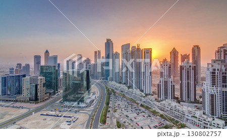 Modern residential and office complex with many towers aerial timelapse at Business Bay, Dubai, UAE. 130802757