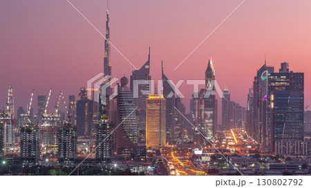 Dubai skyline after sunset with beautiful city center lights and Sheikh Zayed road traffic timelapse, Dubai, United Arab Emirates 130802792