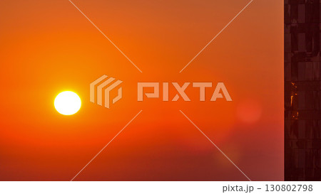 Sunrise close up view over Dubai skyline in the morning, aerial top view from downtown timelapse. Sunrise close up view over Dubai skyline in the morning, aerial top view from downtown timelapse. 130802798