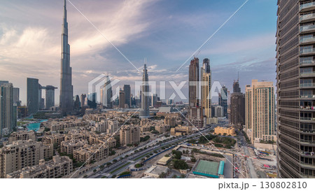 Dubai Downtown skyline day to night timelapse with Burj Khalifa and other towers paniramic view from the top in Dubai 130802810