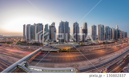 Aerial top view to Sheikh Zayed road near Dubai Marina and JLT night to day timelapse, Dubai. Aerial top view to Sheikh Zayed road near Dubai Marina and JLT night to day timelapse, Dubai. 130802837