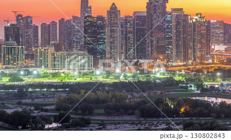 Jumeirah lake towers skyscrapers and golf course day to night timelapse, Dubai, United Arab Emirates Jumeirah lake towers skyscrapers and golf course day to night timelapse, Dubai, United Arab Emirates 130802843