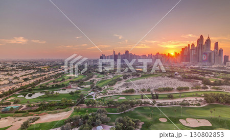 Dubai Marina skyscrapers and golf course sunset timelapse, Dubai, United Arab Emirates Dubai Marina skyscrapers and golf course sunset timelapse, Dubai, United Arab Emirates 130802853