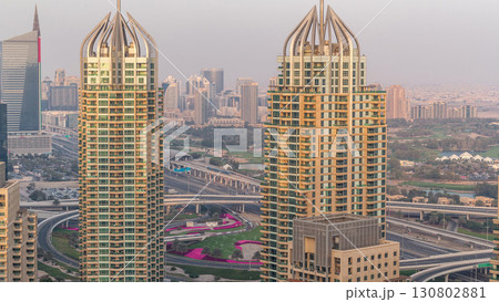 Aerial top view of Dubai Marina morning timelapse. Modern towers and traffic on the road 130802881