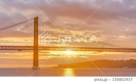 Lisbon city sunrise with April 25 bridge timelapse 130802937