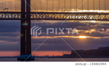 Lisbon city sunrise with April 25 bridge timelapse 130802944