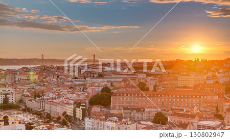 Lisbon at sunset aerial panorama view of city centre with red roofs at Autumn evening timelapse, Portugal Lisbon at sunset aerial panorama view of city centre with red roofs at Autumn evening timelapse, Portugal 130802947
