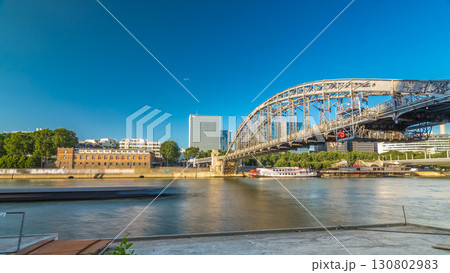 The Austerlitz viaduct in Paris timelapse hyperlapse, seen from bank of the river Seine with a metro train passing 130802983