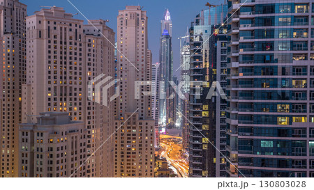 Evening illumination of Dubai Marina day to night aerial timelapse, UAE. Evening illumination of Dubai Marina day to night aerial timelapse, UAE. 130803028
