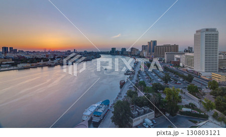 Dubai creek landscape at sunset timelapse with boats and ship near waterfront Dubai creek landscape at sunset timelapse with boats and ship near waterfront 130803121