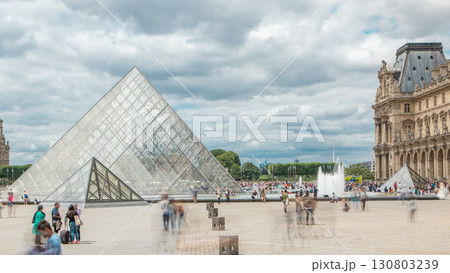 Tourists posing and making photos near fountain timelapse, famous French museum. Paris, France 130803239
