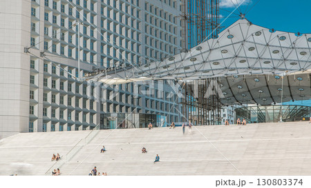 Close up view of Defence business district in Paris timelapse. People sitting on stairs during the day. Paris, France. 130803374
