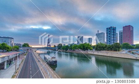 Eiffel Tower sunrise timelapse with boats on Seine river and in Paris, France. 130803386