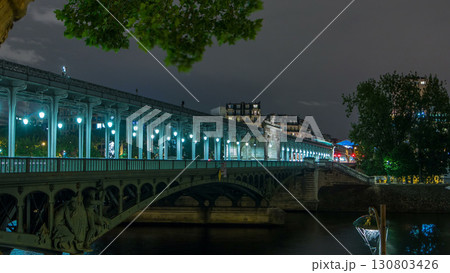 View of pont de Bir-Hakeim night timelapse - a bridge that crosses the Seine River. Paris, France View of pont de Bir-Hakeim night timelapse - a bridge that crosses the Seine River. Paris, France 130803426