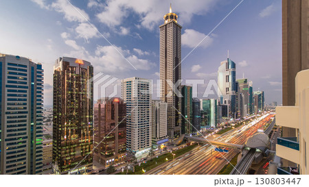 Downtown Dubai towers day to night timelapse. Aerial view of Sheikh Zayed road with skyscrapers after sunset. 130803447